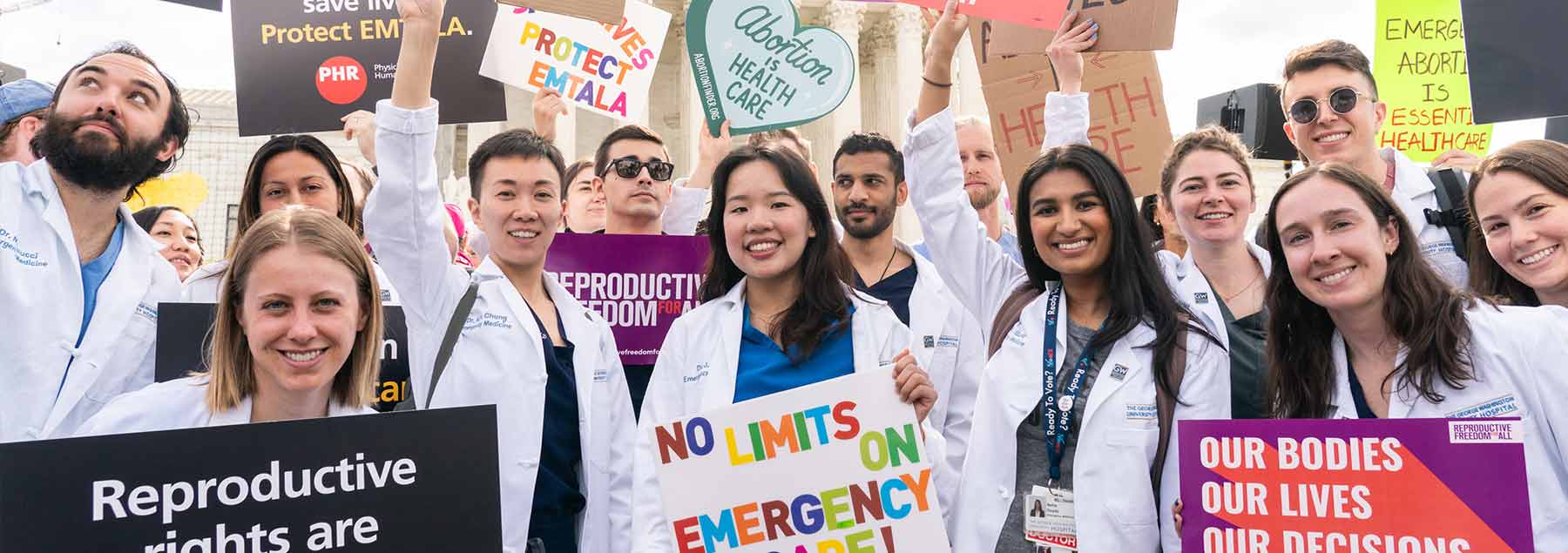 People holding signs to advocate for abortion rights in front of the US Supreme Court