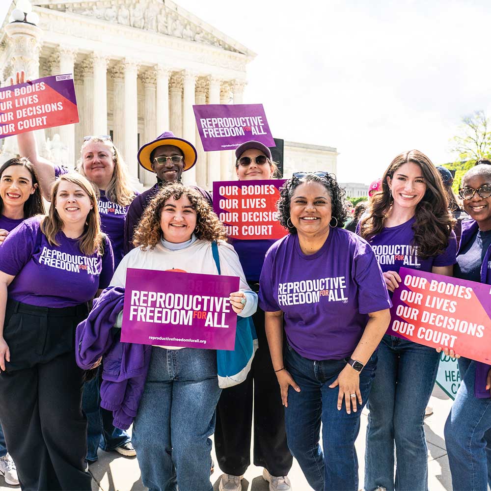 Reproductive Freedom for All Staff holding signs outside of the US Supreme court to advocate for abortion rights.