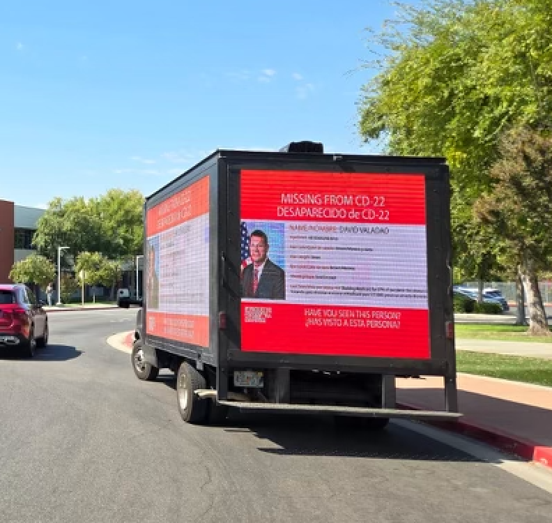 Moving billboard featuring Rep. David Valadao to hold him accountable for voting to gut health care.