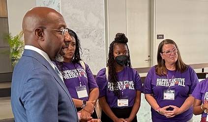 Sen. Rev. Raphael Warnock with Reproductive Freedom for All Georgia members