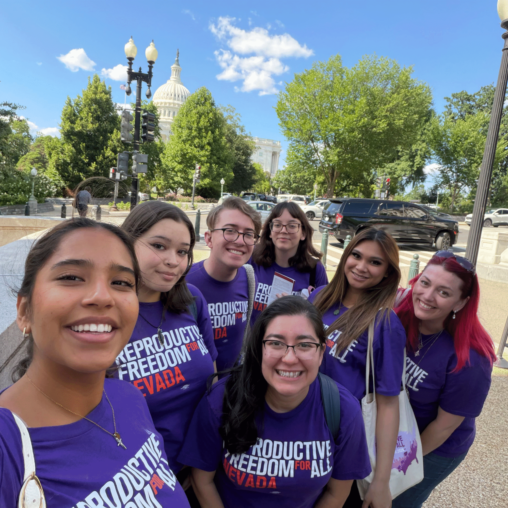 Reproductive Freedom for All Nevada members pose for a selfie in front of the state capitol building.