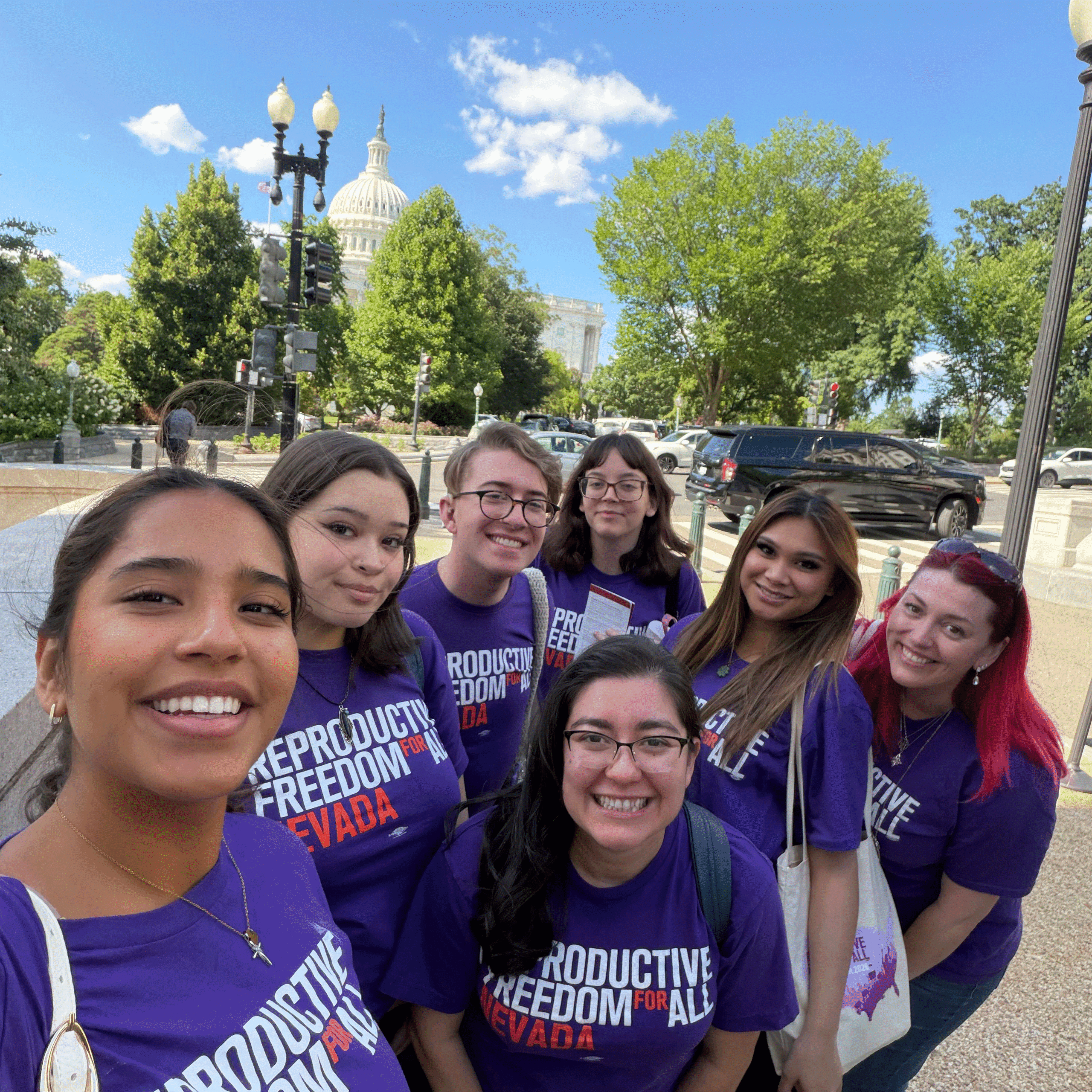 Reproductive Freedom for All Nevada members pose for a selfie in front of the state capitol building.